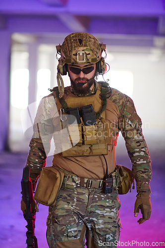 Image of A professional soldier undertakes a perilous mission in an abandoned building illuminated by neon blue and purple lights