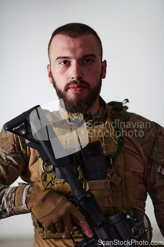 Image of Modern warfare soldier portrait in urban environment