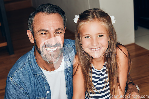 Image of I love her more than anything in this world. Portrait of an adorable little girl spending quality time with her father at home.