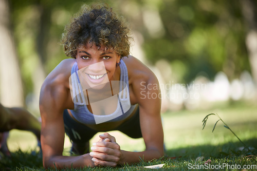 Image of Strengthening the core. a beautiful young woman exercising outdoors.