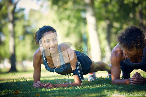 Image of Were motivating each other on a daily basis. two sporty young woman exercising outdoors on a sunny day.