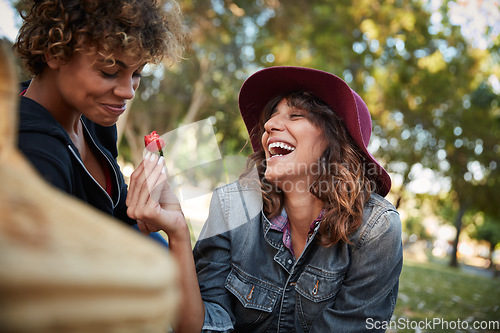 Image of Take another bite of the love fruit. a young couple spending the day outdoors on a sunny day.