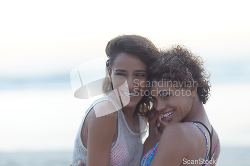 Image of Together is a magical place. two young women enjoying themselves at the beach.