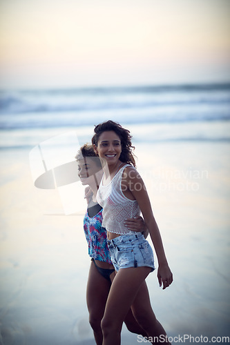 Image of Some beach time is all you need. two young women enjoying themselves at the beach.