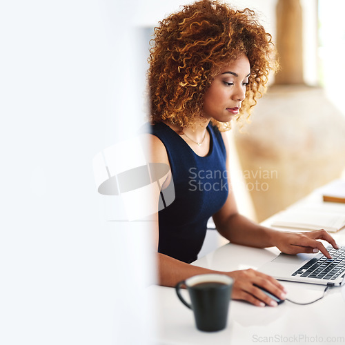 Image of Register your domain name and set up your website. a young businesswoman working on her laptop.