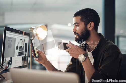 Image of Coffee served with a side of social media. a young businessman having coffee and using a smartphone during a late night in a modern office.