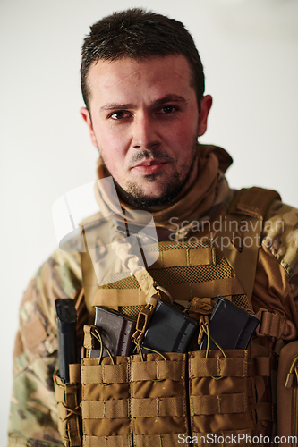 Image of Modern warfare soldier portrait in urban environment