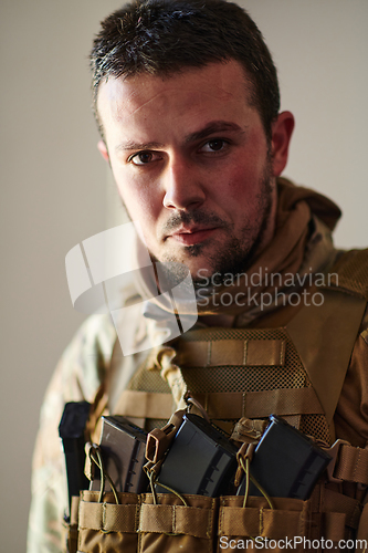 Image of Modern warfare soldier portrait in urban environment