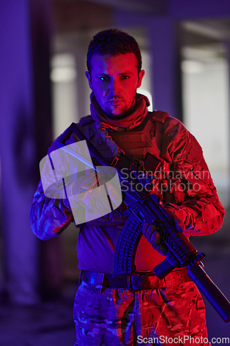 Image of A professional soldier undertakes a perilous mission in an abandoned building illuminated by neon blue and purple lights