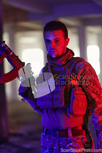 Image of A professional soldier undertakes a perilous mission in an abandoned building illuminated by neon blue and purple lights