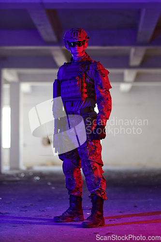 Image of A professional soldier undertakes a perilous mission in an abandoned building illuminated by neon blue and purple lights