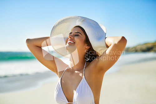 Image of I wish I could live in swimwear. Closeup shot of a beautiful young woman spending some time at the beach.