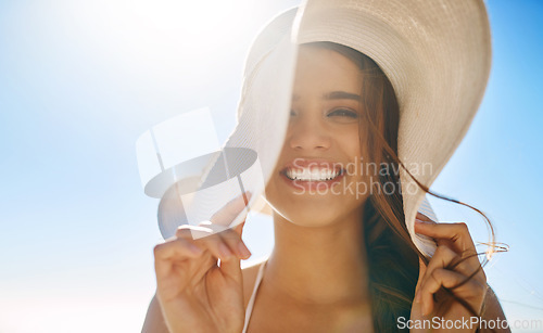 Image of Guess my favorite season. Closeup shot of a beautiful young woman spending some time at the beach.