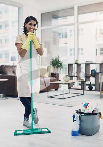 Image of Nothing says welcome home like a clean house. a young woman cleaning her home.