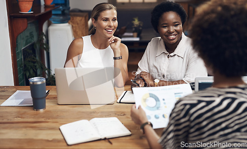 Image of The finance dream team strikes again. a group of young businesswomen having a meeting in a modern office.