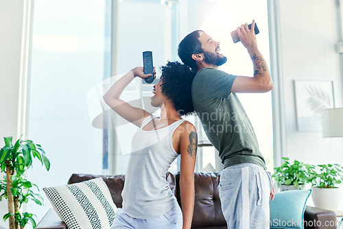 Image of Were super comfortable around each other. a couple having a sing along at home.