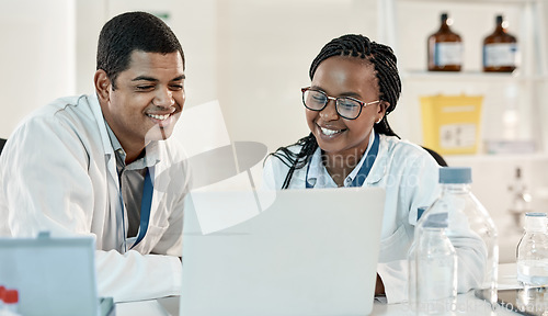 Image of Making new discoveries as a team. two scientists working together on a laptop in a lab.