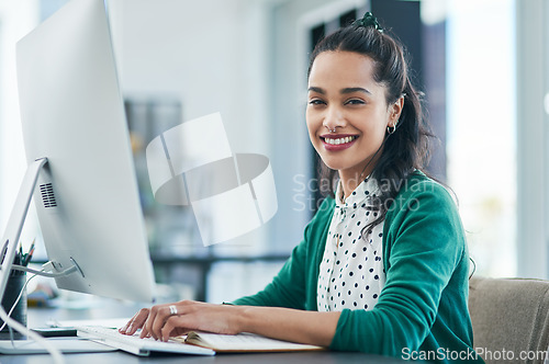 Image of My new product is like nothing else on the market. Portrait of a young businesswoman using a computer in a modern office.