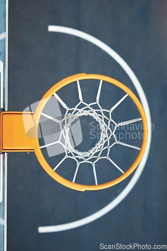 Image of Quest for the net. Closeup shot of a basketball hoop on a sports court.