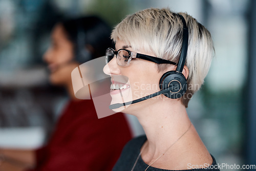 Image of We have all the expert advice you need. a young businesswoman wearing a headset while working in an office.