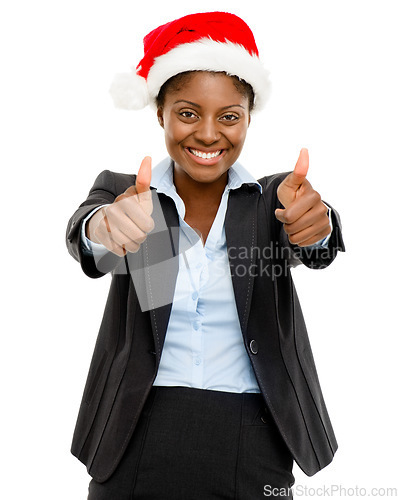 Image of Merry Christmas from our company to yours. Studio shot of a confident young businesswoman wearing a Santa hat and showing thumbs up against a white background.