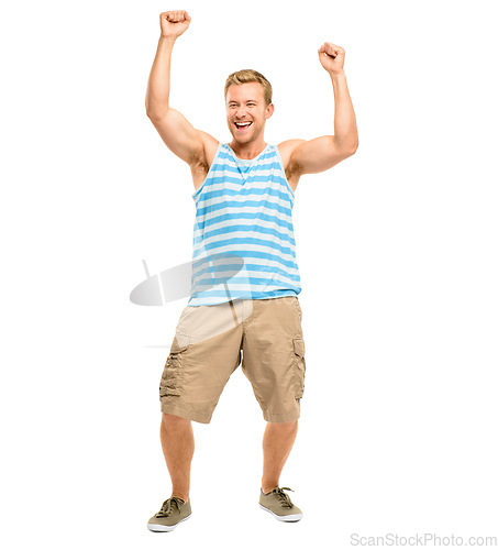 Image of Yipee. Full length shot of a handsome young man standing alone in the studio with his arms raised in celebration.