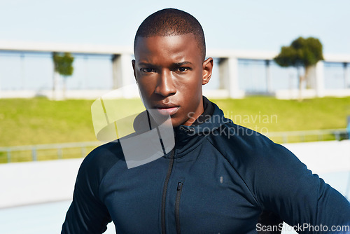 Image of Im here to win. Cropped portrait of a handsome young male athlete standing outside at the track.
