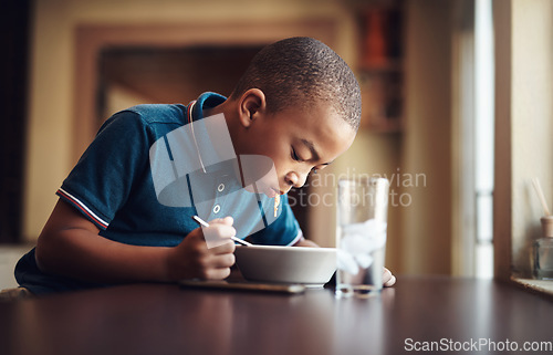 Image of Hell never say no to a bowl of spaghetti. a young boy eating a bowl of spaghetti at home.