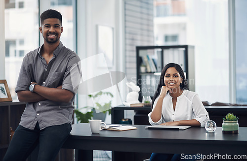 Image of We always bring a fresh rush of enthusiasm to work. Portrait of a young businesswoman sitting in an office with her colleague in the foreground.