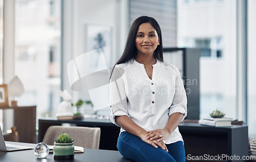 Image of With confidence, you have won before you have even started. Portrait of a confident young businesswoman in an office.