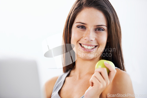 Image of Smile, portrait and woman nutritionist with apple in studio for wellness, diet or eating plan on white background. Weight loss, face and female health influencer with blog survey, help or menu guide