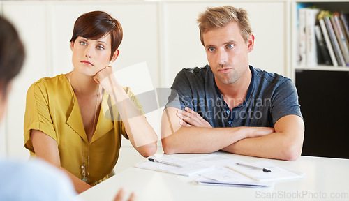 Image of Couple, documents and stress or consultant meeting for future planning, investment or bookkeeping. Man, woman or paperwork or listening financial advisor for decision risk talk, savings policy or tax