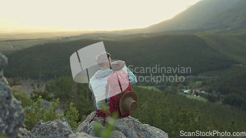 Image of Hiking, mountain and man with backpack, water bottle and relax on outdoor adventure with freedom in nature. Trekking, rock climbing and hiker sitting for drink break, horizon and motivation with view