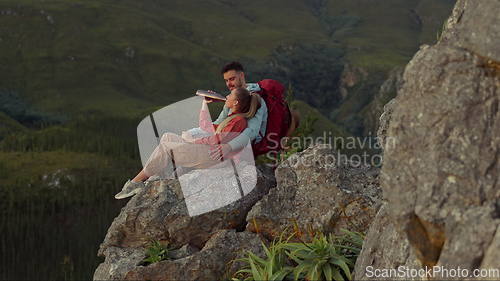 Image of Hiking, mountain and drinking water, couple relax on outdoor adventure and peace in nature with romance. Trekking, rock climbing and love, man and woman with view of natural cliff with sharing drink.