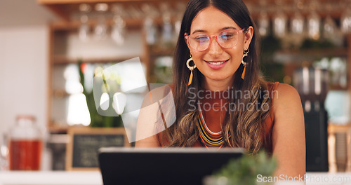 Image of Laptop, freelance and woman in coffee shop with glasses, online research career and smile. Communication, technology and remote work, happy girl in cafe at computer, virtual assistant and reflection.