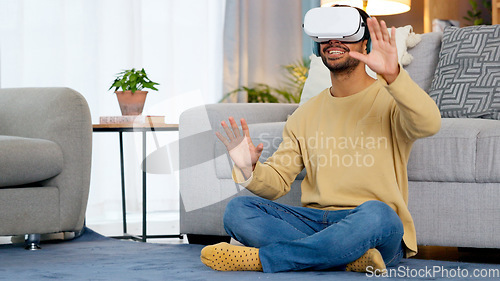 Image of Home, virtual reality glasses and man on the floor, gaming and connection in a living room. Person, guy and player with esports, online gaming and VR eyewear with headphones, futuristic and relax