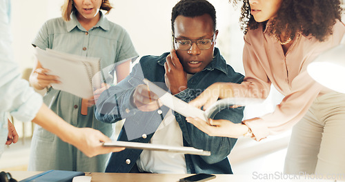 Image of Business man, overwhelmed and hands with phone call, documents and support staff in busy office. Leader, manager or tired boss with notebook, paperwork and burnout with employee group with questions