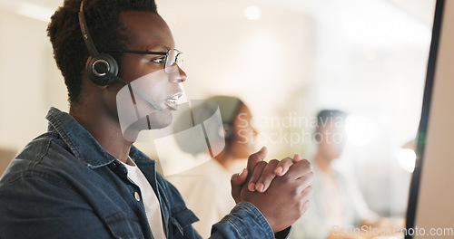 Image of Call center, consulting and agent with black man in office for contact us, communication and customer service. Salesman, help desk and technical support with person in crm agency for telemarketing