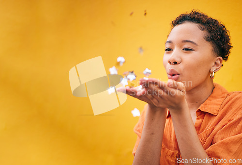 Image of Blowing, petals and African woman on orange background for natural beauty, skincare and romance. Flowers, happy and female person with floral confetti for cosmetics, wellness and aesthetic in studio