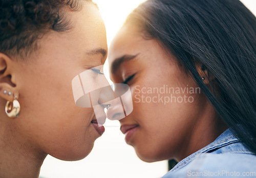 Image of Lgbtq couple, love and intimate at sunset outdoor, bonding and romance on date together. Partner, gay women and nose touch for care, commitment and loyalty, trust and support for lesbian people