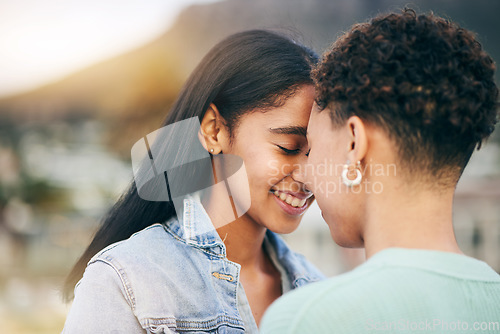 Image of Women, lesbian and couple with forehead touch and love, pride with gen z youth and romance outdoor. Female people together, gay relationship and lgbt with date, partner and trust with hug and support