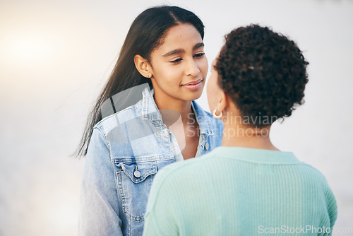 Image of Sunset, lesbian and couple with love and care together on an outdoor vacation or holiday for romance travel. Lgbtq, pride and women bonding on a summer date for adventure, relax and happiness