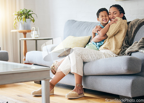 Image of Living room hug, relax or happy mom, child and smile for family relationship, Mothers Day affection or care. Lounge couch, embrace and excited mama, mum or woman bonding with kid in home quality time