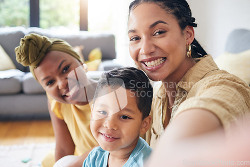 Image of Lesbian, women and boy in family selfie, smile and care with portrait, post and web blog on floor in home living room. Mother, male kid and happy for love, bonding or memory for social media in house