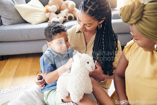 Image of Happy lesbian couple, child and adoption in home for family bonding or quality time on living room floor. LGBTQ or gay women and little boy in happiness together for holiday weekend or break in house