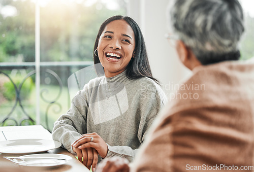 Image of Smile, family dinner and woman laughing or happy at a table for a gathering event in a home at lunch. Joke, happiness and person at a celebration with mother for unity meal or supper in dining room