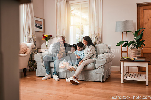 Image of Laptop, sofa and family watching a movie online together in the living room of their home. Relax, technology and cute children streaming film, show or video on a computer with their parents in house.