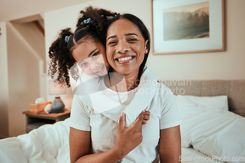 Image of Portrait, mother and girl with on a bed, hug and happiness with quality time, love and weekend. Family, mama or female child with joy, home or fun in a bedroom, face and embrace with a smile or relax