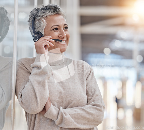 Image of Call center, mature woman and microphone for communication, customer service or thinking of telecom questions. Telemarketing agent consulting for CRM support, sales and solution for FAQ advisory help