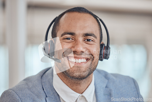 Image of Call center, smile and face of man with headphones in office for telemarketing, support and crm. Contact us, portrait and customer service professional, sales agent and happy consultant from Brazil